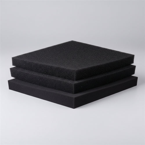 Three black foam pads stacked on a white background