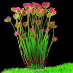 Artificial aquarium plant with pink and green leaves on a black background