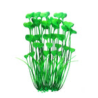 Artificial green aquarium plant with a measurement indicator on a black background