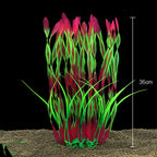 Artificial aquarium plant with red and green colors on a black background