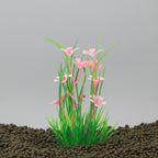 Aquarium plant with pink flowers and green leaves on a dark background