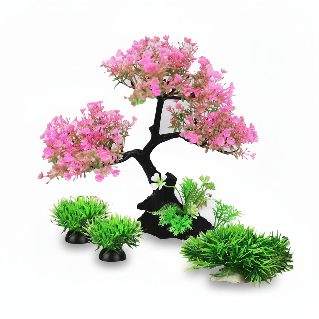 Artificial bonsai tree with pink flowers and green plants on a white background