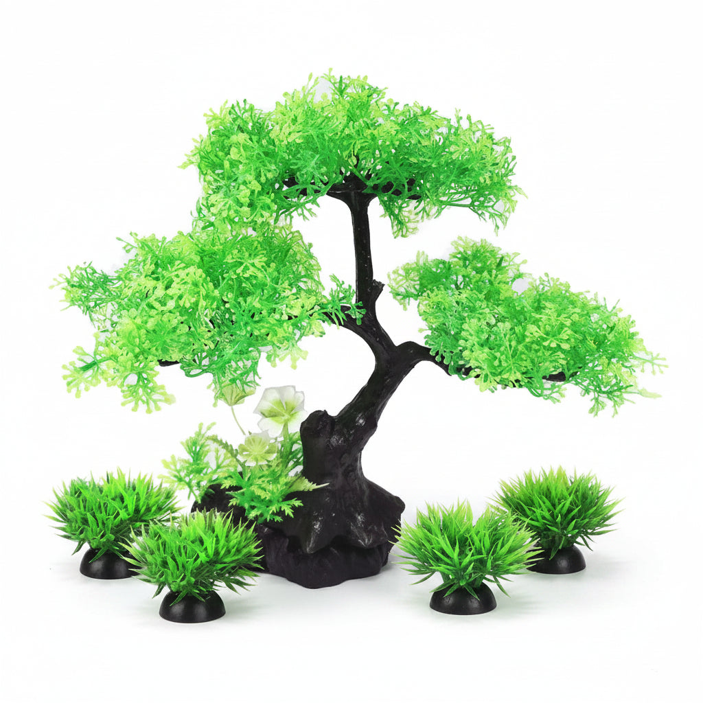 Artificial green tree and grass set on a white background
