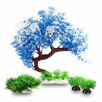 Decorative aquarium tree with blue leaves and green plants on a white background