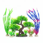 Collection of various artificial aquarium plants in different colors on a white background.