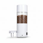 White pet feeder with clear container on a gray background