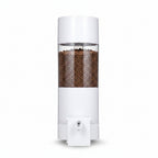 White pepper grinder with clear top on a gray background