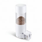 White cylindrical pepper grinder with clear top on a gray background