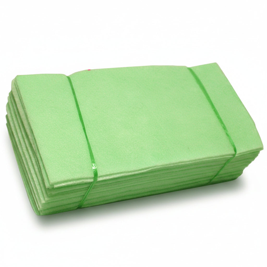 Stack of green mats against a blue water background