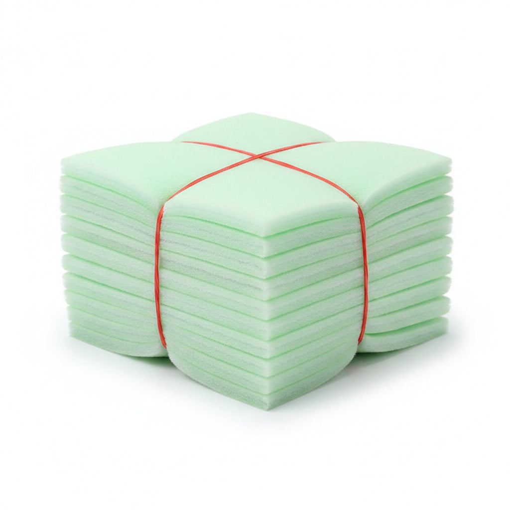 Stack of green cotton pads with a red band on a white background