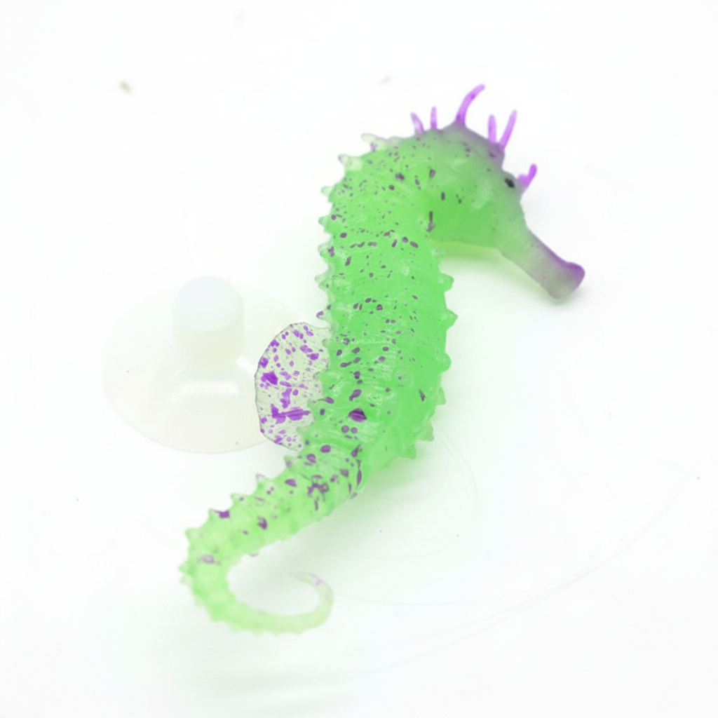 Green and purple seahorse toy on a white background
