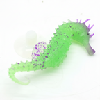 Green and purple seahorse toy on a white background