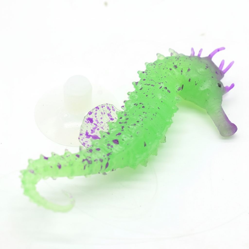 Green and purple seahorse toy on a white background