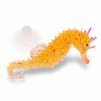 Orange seahorse toy with a white shell on a white background