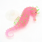 Pink seahorse with green spots on a white background