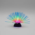 Colorful artificial coral in an aquarium with text about reliable silicone material.