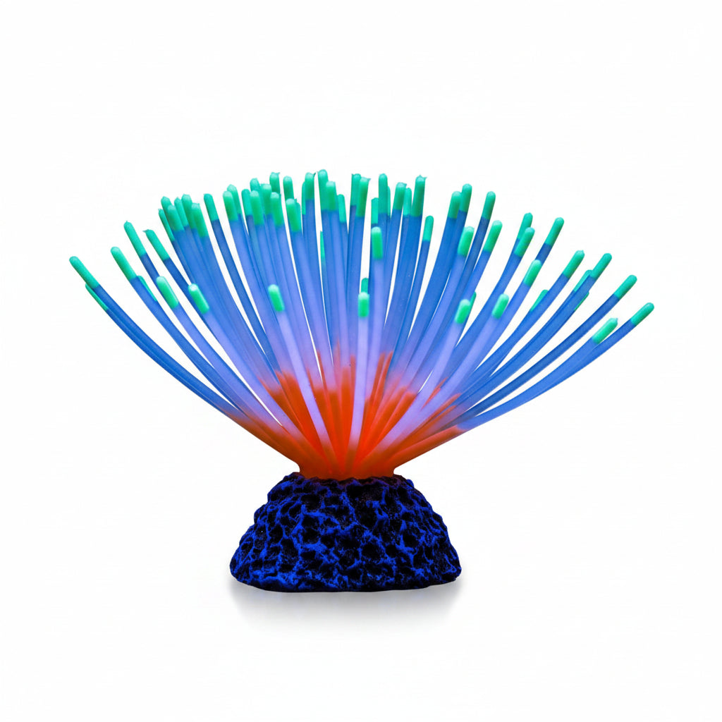Glowing fiber optic light with blue and green fibers on a black background