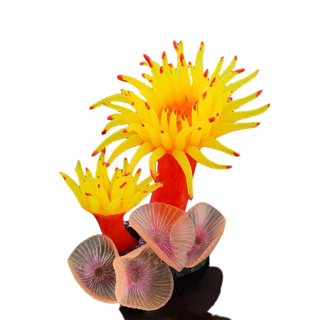Decorative coral with yellow polyps and red tips on a dark background