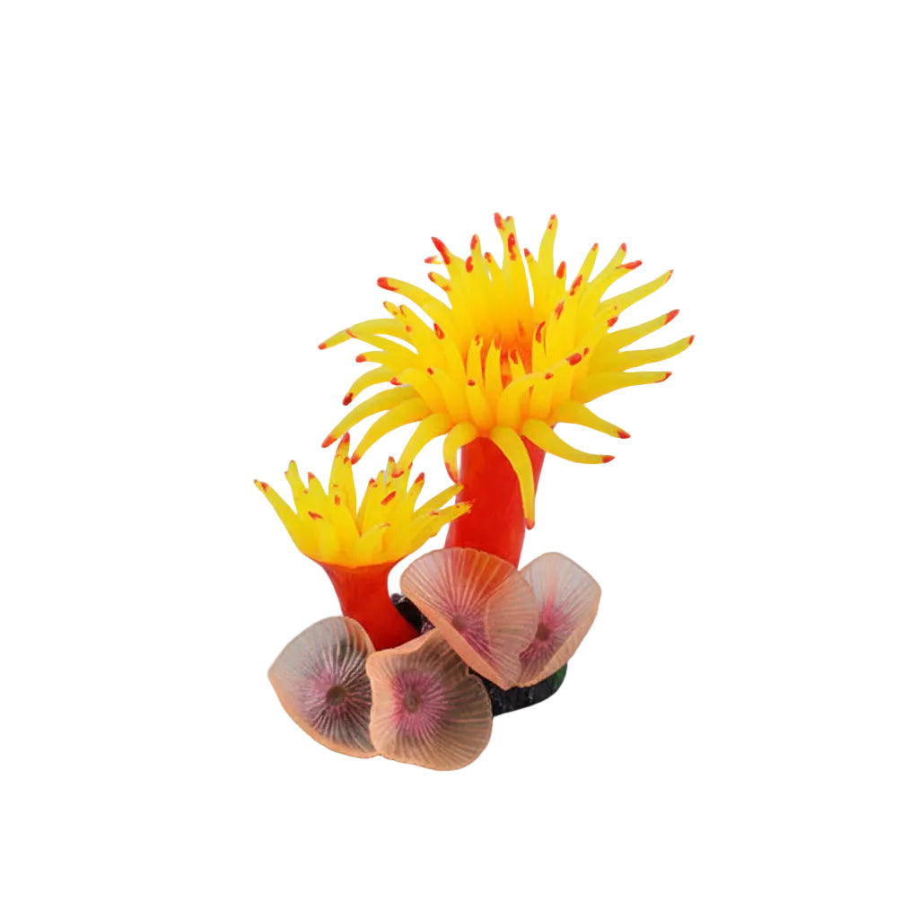 Decorative coral with yellow polyps and red tips on a dark background